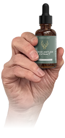 Deer antler extract bottle in hand